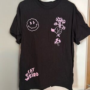 Spencer’s black stay weird t-shirt
